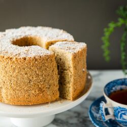 A plate containing Earl Grey Chiffon Cake dusted with powdered sugar on top.