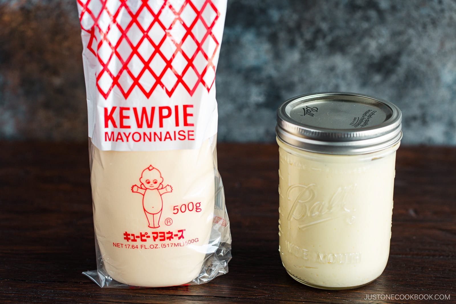 A mason jar of homemade Japanese mayonnaise next to a bottle of Kewpie mayonnaise.