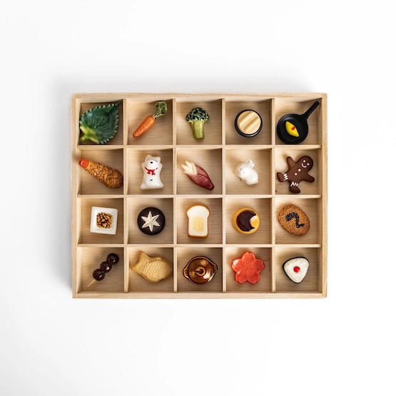 Miniature Japanese food and dessert charms in a wooden tray, perfect for crafting or decoration, featuring detailed, cute, and colorful designs.