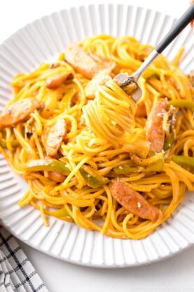 A white plate containing Ketchup Spaghetti (Napolitan).